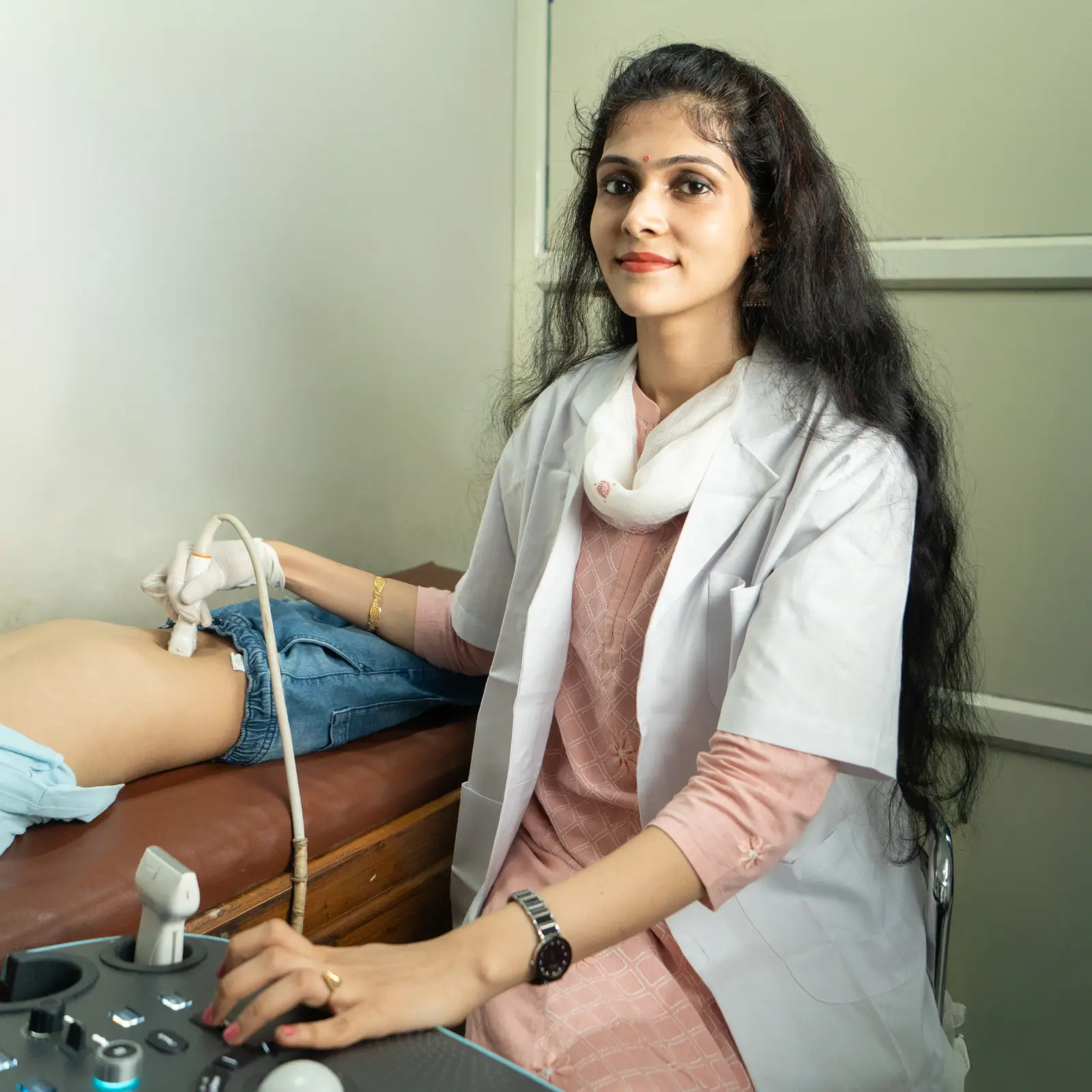 Beautiful young female doctor looking at camera in the office.